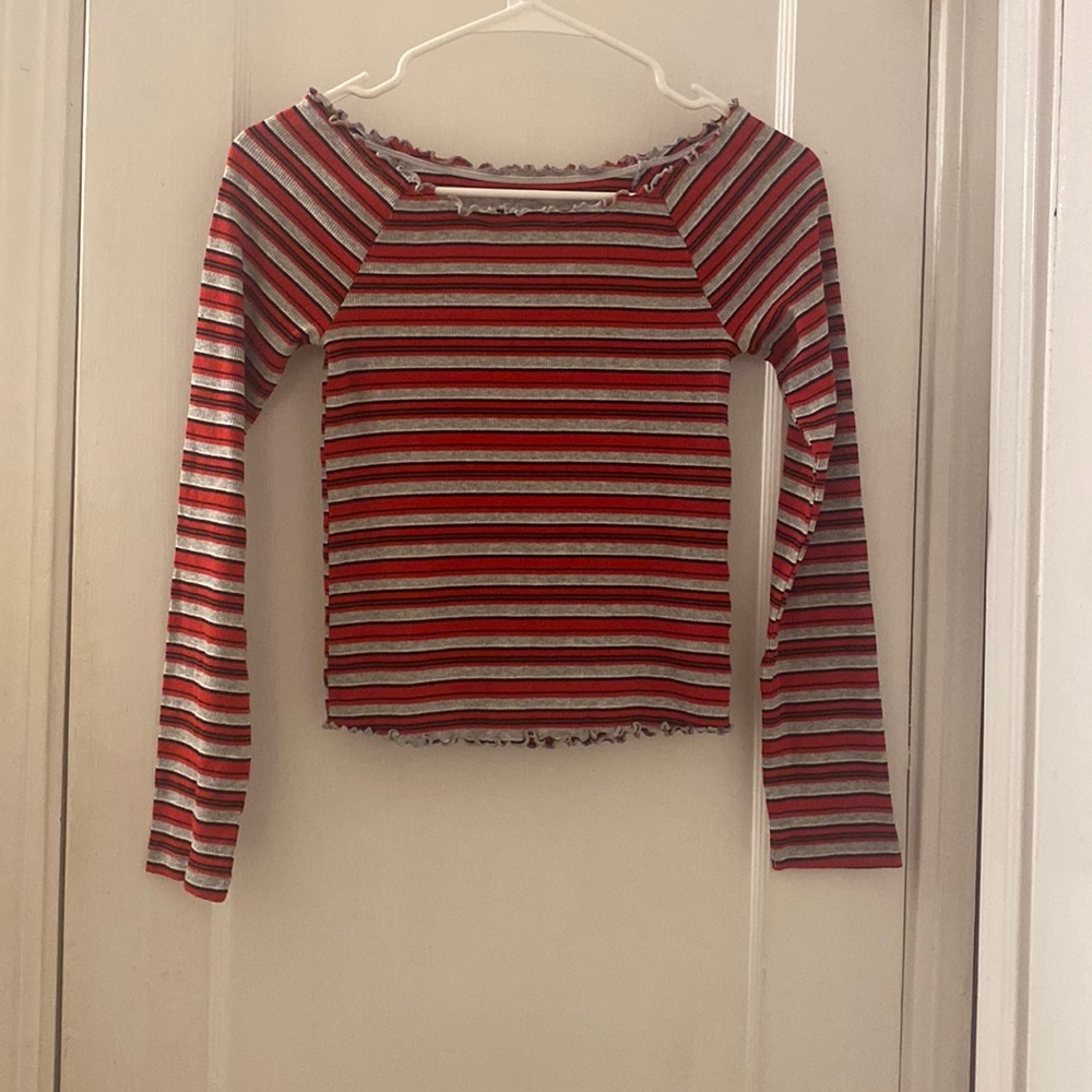 Red and white striped, long sleeve shirt. It can be worn on/off the shoulders.